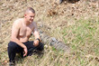 Photo: man catches a snake man catches a snake