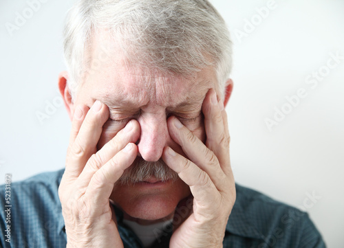 Photo: older man has pain in his sinuses older man has pain in his sinuses