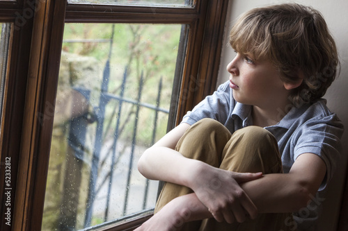 Photo: Sad Young Boy Child Looking Out Window Sad Young Boy Child Looking Out Window