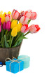 Photo: tulip flowers in wooden pot with gift boxes tulip flowers in wooden pot with gift boxes