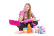 beautiful woman sitting with cleaning equipment isolated on whit