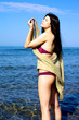 Gorgeous woman getting tanned in the water