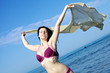 Incredibly beautiful woman enjoying the sea and the wind