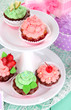Delicious beautiful  cupcakes on festive table close-up