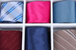Neckties in wooden box close-up