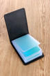 Black business card holder on wooden background