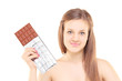 Beautiful young female holding a big chocolate
