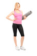 Photo: Full length portrait of a young female with an exercising mat Full length portrait of a young female with an exercising mat