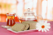 Tasty halva with tea on table in room