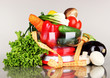 Fresh vegetables in scales on gray background