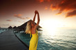 woman in a dress on maldivian sunset
