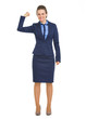 Full length portrait of happy business woman showing biceps
