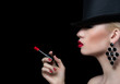 Beautiful blonde woman with cigarette and red lips