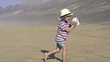 Boy with beautiful seashell on the beach, super slow motion