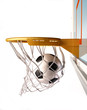 Soccerball centering the basket, close up view.