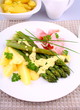 Green asparagus with prosciutto, potato, parsley and sauce