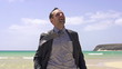 Happy businessman on the beach, super slow motion, shot at 240fp