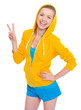 Happy teenager girl showing victory gesture