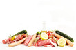 Foto: raw meat with rosemary, lemon on a white background raw meat with rosemary, lemon on a white background