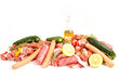 Foto: raw meat with rosemary, lemon on a white background raw meat with rosemary, lemon on a white background
