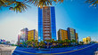 beach scene,  blue sky and hotel