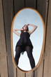 thoughtful woman with her reflection in mirror