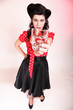 Photo: Young woman retro style drinking water Young woman retro style drinking water