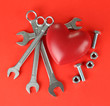 Heart and tools. Concept: Renovation of heart. On color
