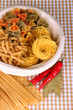 Different types of pasta on checkered background