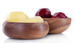 Peeled vegetables in wooden bowls isolated on white