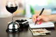 Hand signing in notebook, on bright background