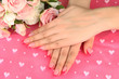 Closeup of hands of young woman with elegance manicure,