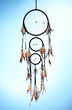 Beautiful dream catcher on blue background