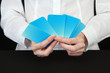 Hand with business cards. Concept: Business like poker game.