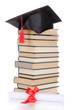 Grad hat with diploma and books isolated on white