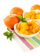 Orange jam with zest and tangerines, isolated on white
