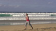 Man and woman jogging on the beach