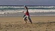 Couple jogging, race on the beach, super slow motion