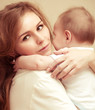 Young happy mother with baby