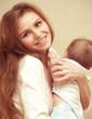 Young happy mother with baby