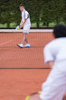 Men playing tennis