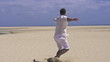 Young happy man on the beach, super slow motion, shot at 240fps
