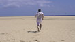 Man running on beautiful beach