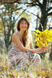  happy woman in autumn with oak posy