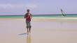 Woman jogging on beautiful beach, super slow motion, 240fps