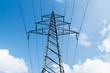 High voltage lines against a blue sky