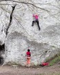 Young women climbing on limestone wall
