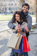 Happy Young Couple with Shopping Bags