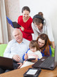 Happy  family uses few  electronic devices