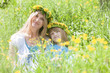 mother and son with flwer wreaths